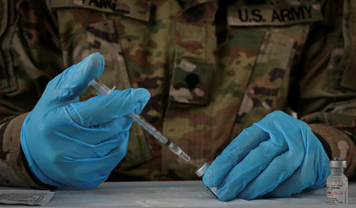 US Army soldier prepares Pfizer coronavirus vaccine